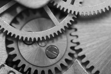 black white background with metal cogwheels a clockwork. macro 