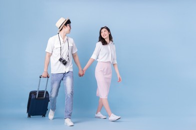 full length image of young asian couple travel, summer vacation