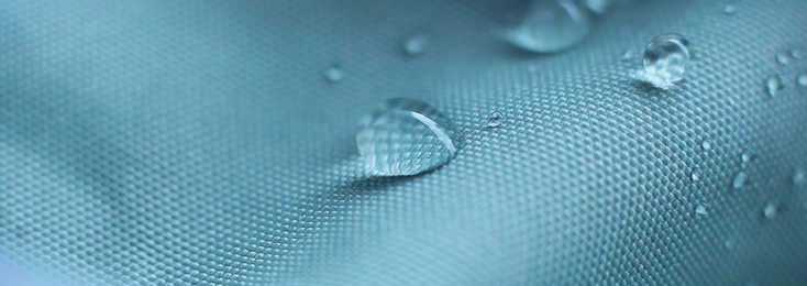 waterproof fabric with waterdrops. non woven fabric water texture background water drops on waterproof nylon fabric. soft focus