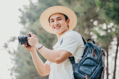 portrait of young asian man traveling