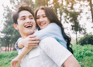 portrait of young asian couple outside