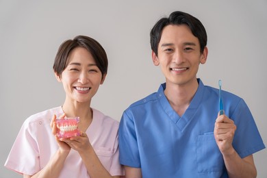 asian men and women in medical clothing