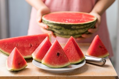sliced watermelon on cutting wooden board ready to eating, tropical fruit in summer season