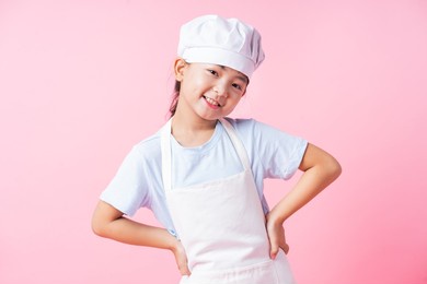 image of asian child practicing to be a chef
