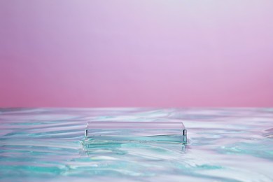 top view of transparent podium and blank space in violet water background