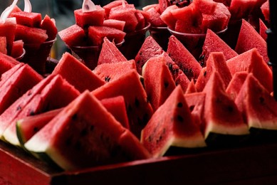 a close up shot of sliced watermelons served in a plates 