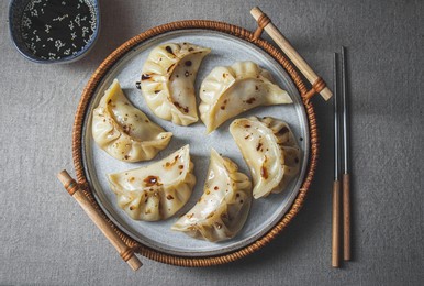 gyoza japanese korean dumplings on gray plate on the tabl. top viewe