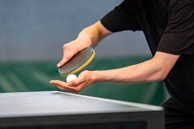 close up of a table tennis player serving