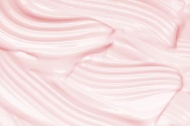 pink cosmetic cream texture. face creme, body lotion surface. skincare creamy product background
