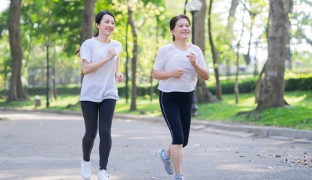 image of asian mother and daughter exercise at park