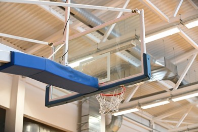 a closeup of a basketball hoop in an old school sport gym hall