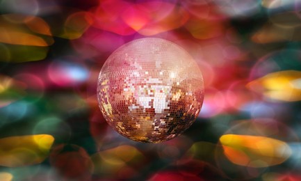 party disco mirror ball reflecting colorful lights with bokeh