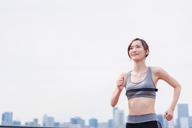 young woman enjoying training outdoors