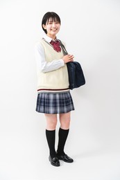 a high school girl with a student bag
