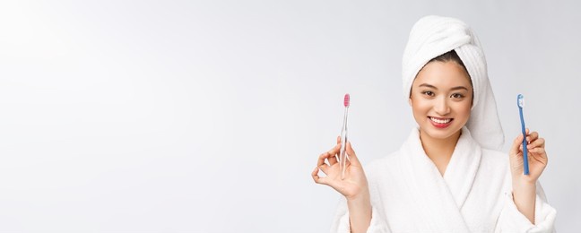 close up of smile woman brush teeth. great for health dental care concept, isolated over white background. asian.