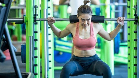 asian woman weightlifter preparing for training, asian woman workout weightlifting in weight training fitness gym, sport exercise and muscular build, healthy lifestyle.