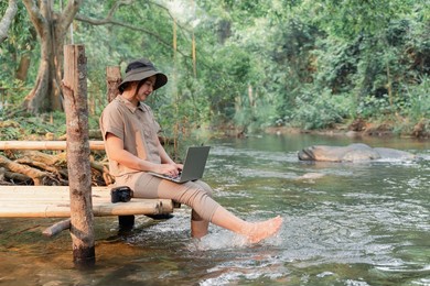 asian woman travel and camping alone. businesswoman online working and relaxing during journey outdoor activity.