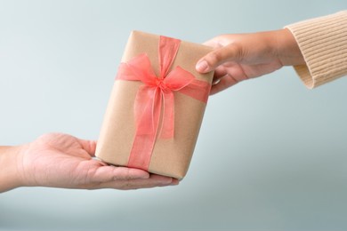 sending and receiving gift with ribbon bow for special occation to someone you love. holidays seasonal to give and to take gift box surprised.