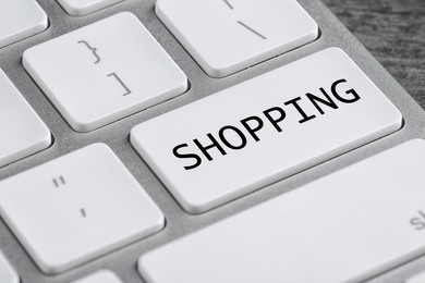 online store. button with word shopping on computer keyboard, closeup