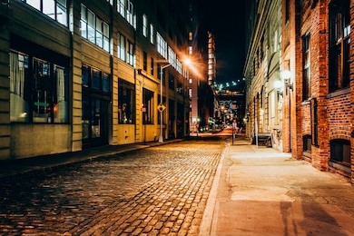 an alley at night, in brooklyn, new york.