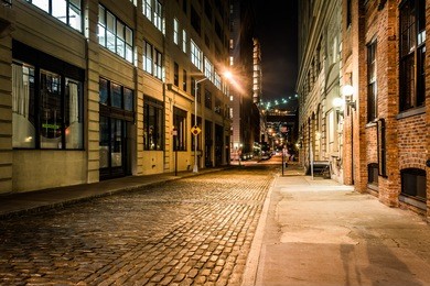 an alley at night, in brooklyn, new york.