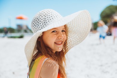 summer portrait of a little girl outdoors on the beach. summer holidays.girl in a hat