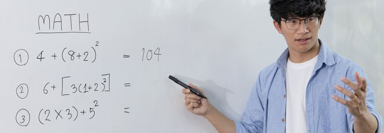 asian teachers are teaching mathematics classes in addition, subtraction, multiplication, and division in high school or university classrooms, math quiz on a white board.