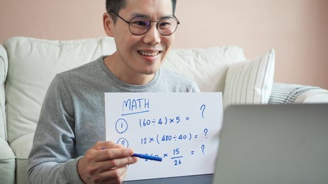asian man teaching math e-learning at home. asian man conference classroom online from home office. handsome man video call present english course. distance education class.