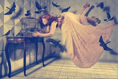 floating levitation shot of a woman and her black birds
