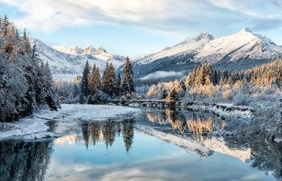 mountain river valley in snowy winter