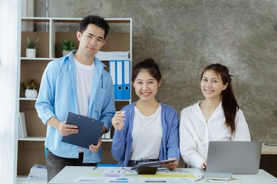 groups asian people chatting, business men and women meeting in a conference room, young business man running and running startups, young and energetic group running companies. startup company concept