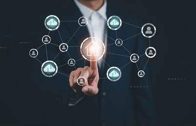 businessman touch button circular futuristic interface of smart home automation assistant on a virtual screen and a user touching a home button, digital big data and virtual technology,