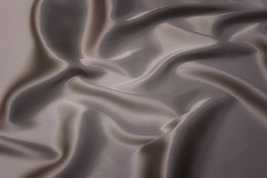 close-up texture of natural beige fabric or cloth in brown color. fabric texture of natural cotton or linen textile material. beige canvas background.