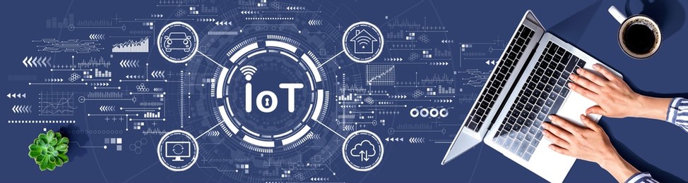 iot theme with person using a laptop computer