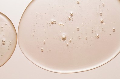 cosmetic serum gel beauty drop on color background. skincare beauty product with bubbles texture.