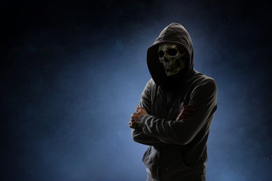 scary and creepy male monster with gouged eyes looking like a skull