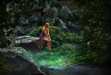 fairy tale. princess in a mystical garden pensively looking down