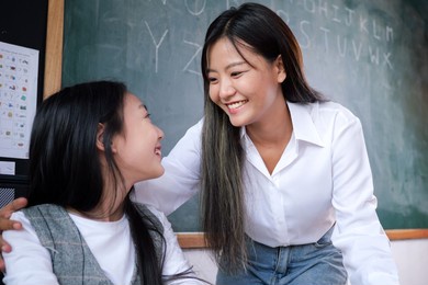 teacher and student with blackboard portrait, student studying in the classroom with teacher teaching, learning development of kid concept