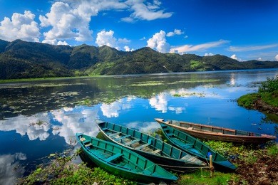 boats on pokhara fewa lake in nepal