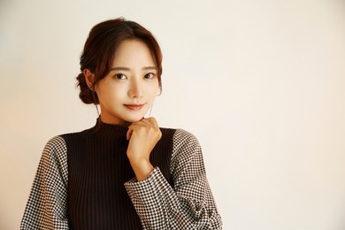 portrait of a young asian woman in autumn fashion