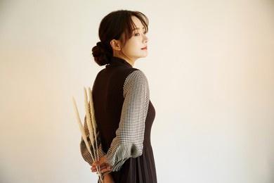 portrait of a young asian woman in autumn fashion