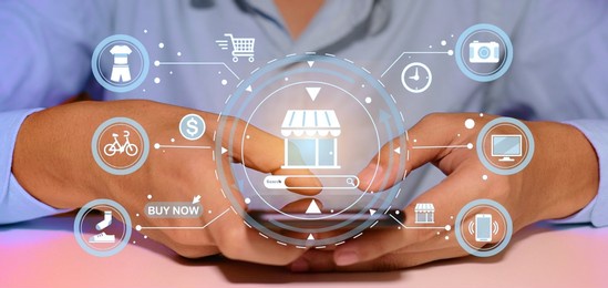 a young man is shopping online through a digital mobile phone screen.