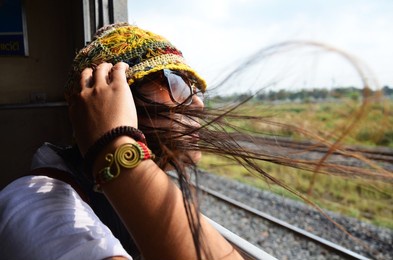 travelers thai women people sitting on railway for journey explorer and portrait posing for take photo at window train go to destination travel visit phra nakhon si ayutthaya from bangkok, thailand