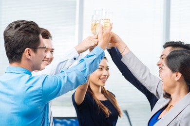 successful business team clinking glasses