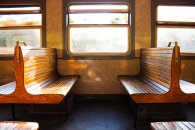 benches and windows of train. interior of wagon train. train ride