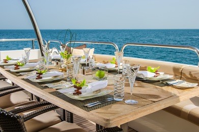 dinning table on the upper deck in luxurious yacht.