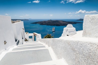 stairs leading down to the sea. white architecture on santorini island, greece. beautiful view on the sea. concept of a perfect holiday