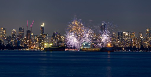 fireworks with cityscape in the background