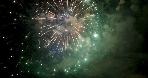 green firework celebrate anniversary happy new year 2023, 4th of july holiday festival. green firework in night time celebrate national holiday. countdown to new year 2023 festival party time event
