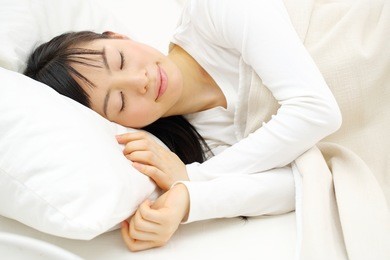 beautiful young woman sleeping on the bed